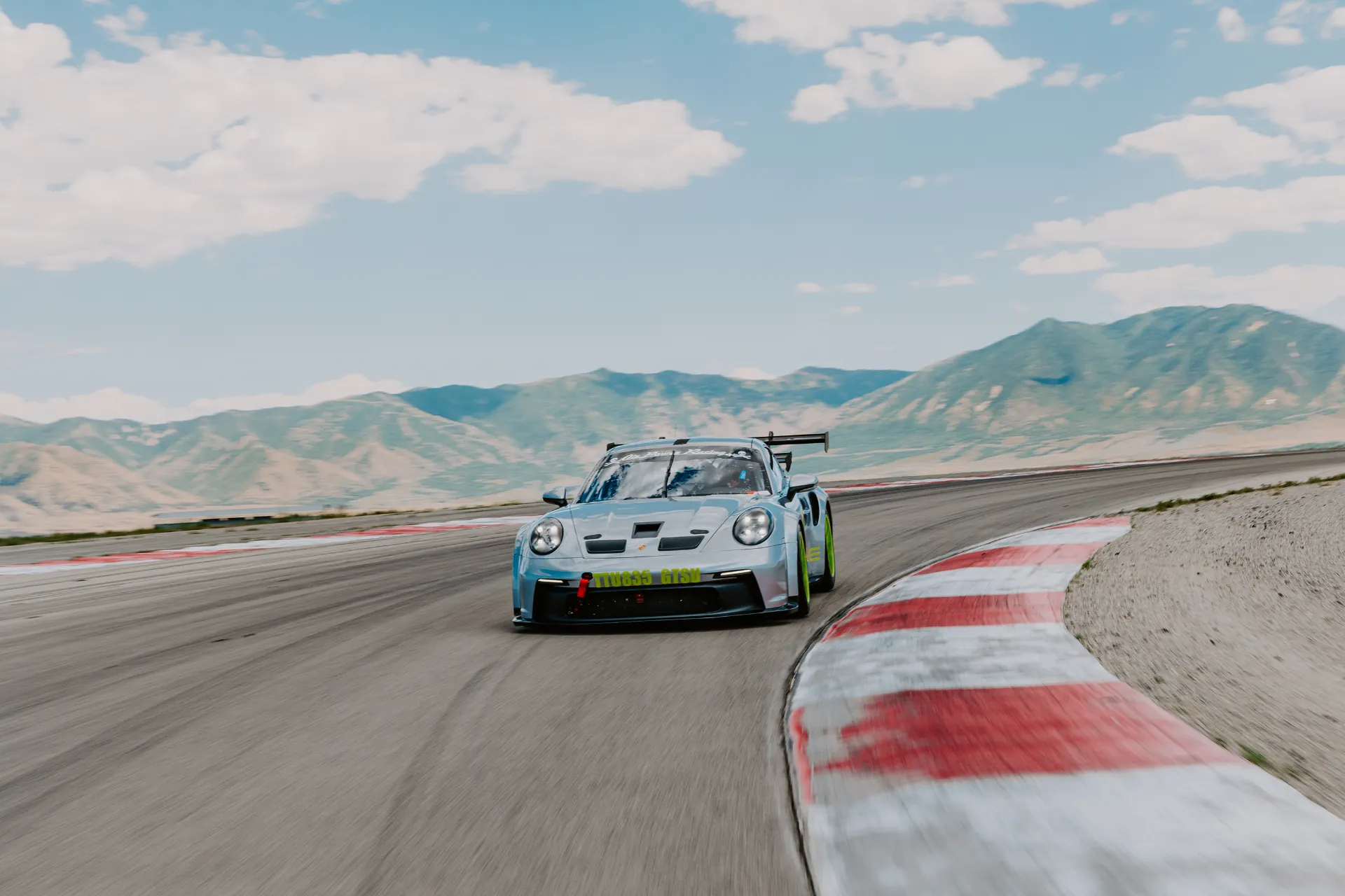Porsche Cup car racing wheel-to-wheel during a NASA road racing weekend.