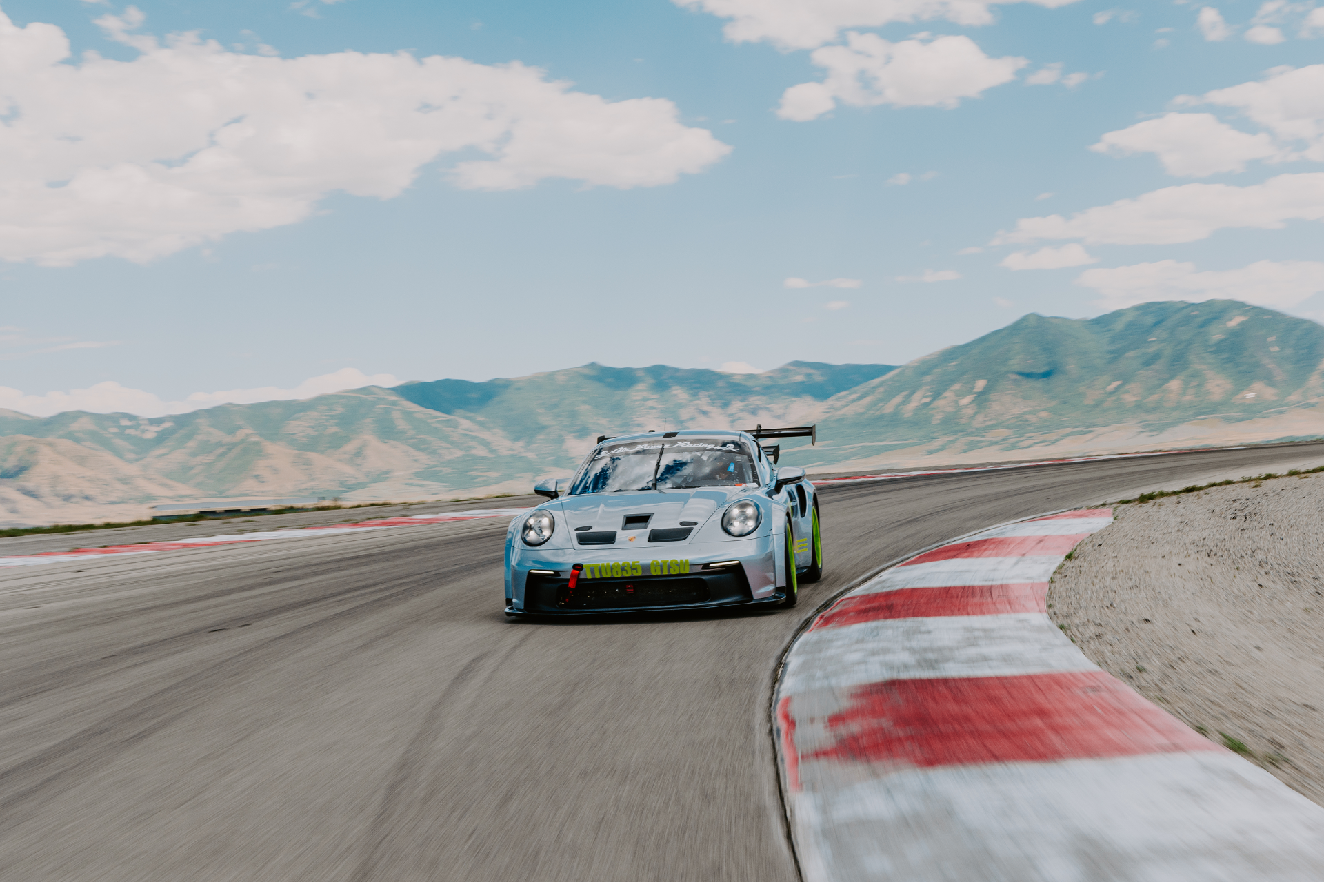 Porsche Cup car racing wheel-to-wheel during a NASA road racing weekend.